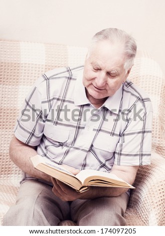 old man reading  book
