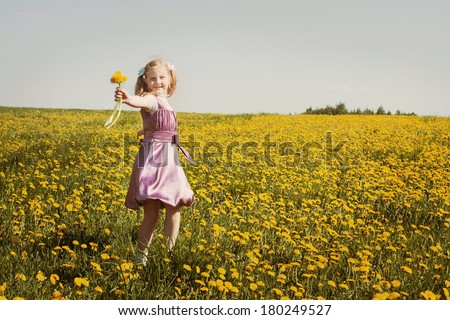 happy girl with dandelion outdoor