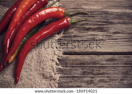 chili peppers on old wooden table