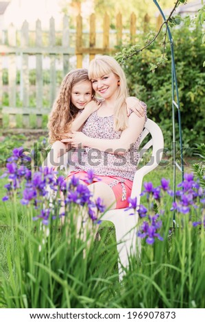 daughter with her mother in the garden