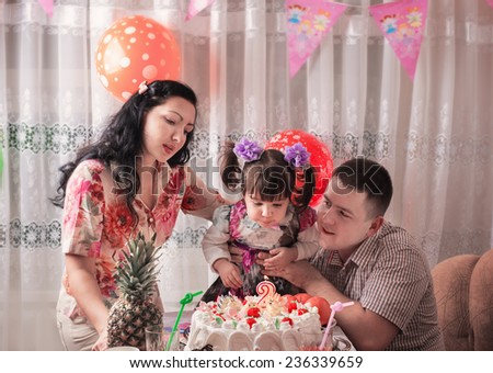 Happy daughter on her birthday\'s day with her family