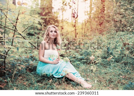 romantic woman in fairy forest