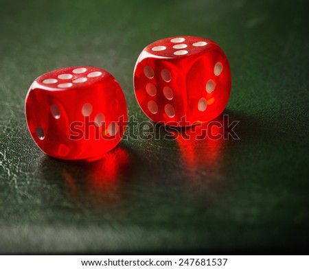 Pair of thrown red dices on green table