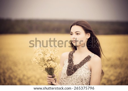 brunette girl with yellow bouquet
