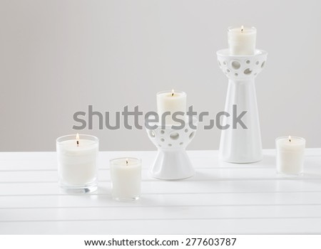 scented candles on white background
