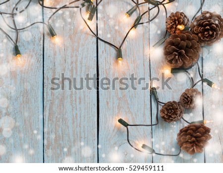 christmas lights on blue wooden background