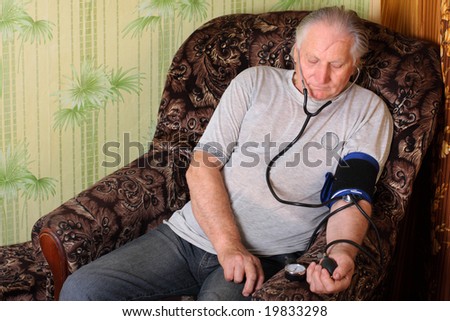 old men with tonometer (blood pressure cuff)