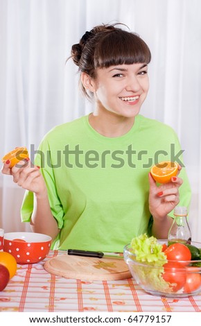 Young smiling woman with fruits and vegetables