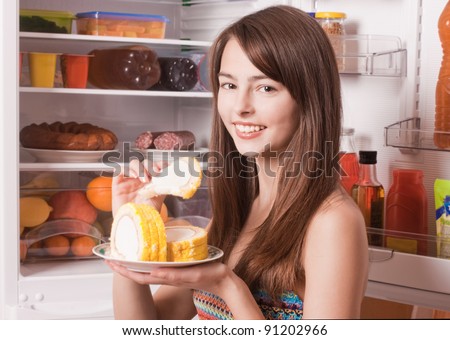 smile girl with cake on kitchen