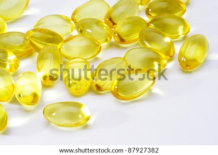 Cod liver oil capsules on white