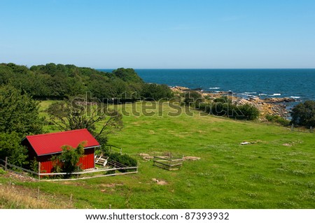 Beautiful view of the sea. House of descent to the sea. Bornholm in Denmark.