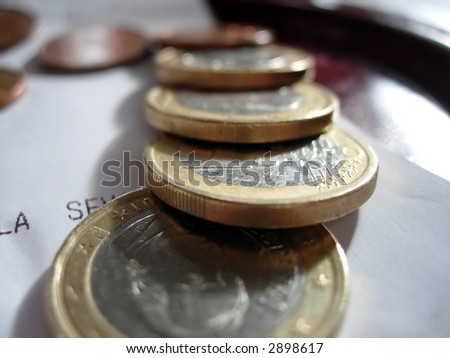 Coins close-up over a restaurant bill