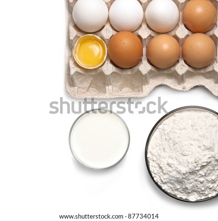 Eggs, glass of milk and flour isolated on white background