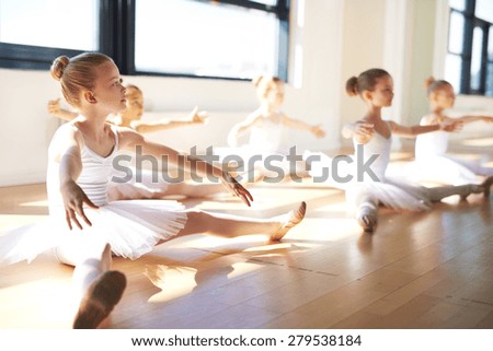 Pretty Young Girls, Wearing White Tutus, Sitting on the Floor at the Studio While Having a Training for Ballet Dance.