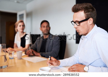 White male executive talking during meeting in conference room