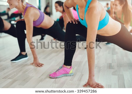 fitness, sport, training, gym and lifestyle concept - close up of people exercising in the gym