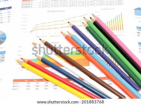 image of color pencils on business paper and desk