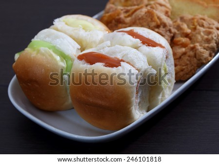 closeup image of burger and cookie on white plate for breakfast