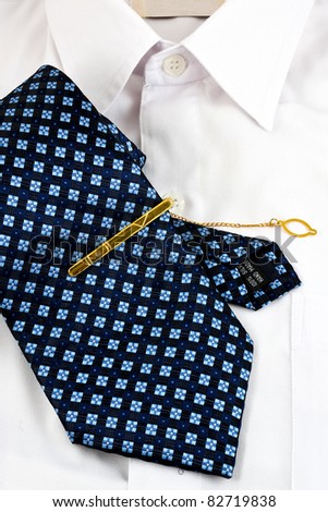 A necktie pin and white shirt for business man