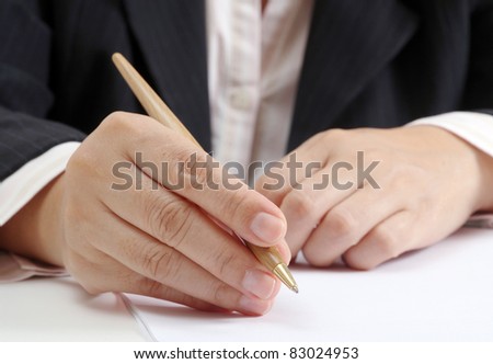 Business woman at her office signing a contract on white paper