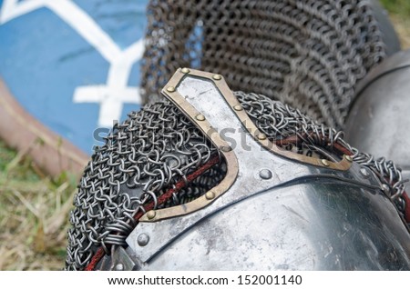 Knight\'s helmet and shield with a stylized emblem of Prince Vladimir of Kiev