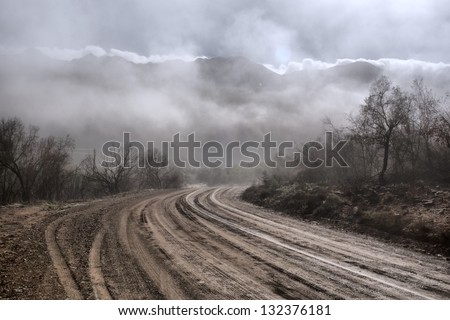Gloomy road in mountains. Shot near Oudtshoorn, Western Cape, South Africa.