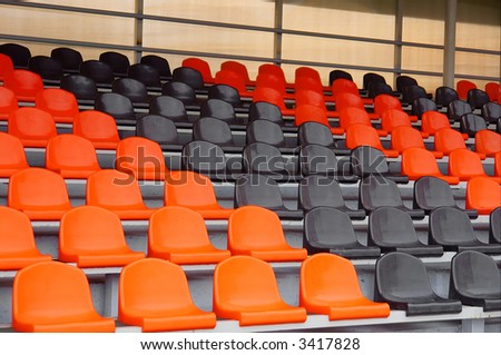 Array of empty plastic chairs on stadium. Shot in Poltavska region, Ukraine