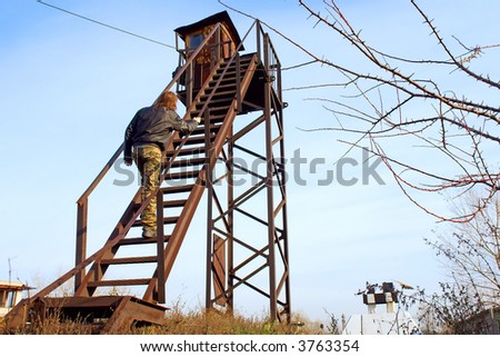 Man climbs on rusty tower. Shot in Poltavska Region, Ukraine