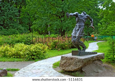 Scenery with male sculpture in botanic garden. Shot in Kiev (Kyiv), Ukraine.