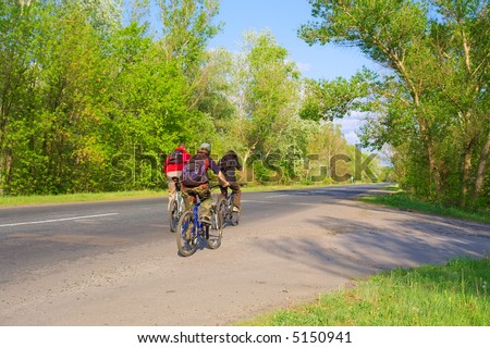 Group of three teen bikers on highway. Shot in Ukraine.