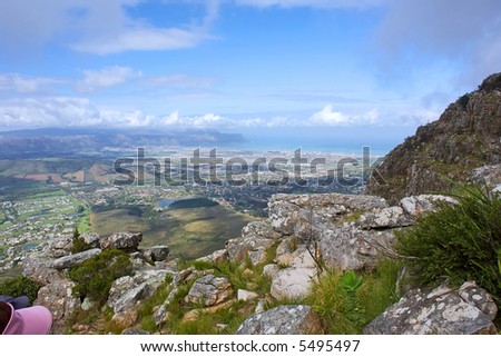View at False Bay from misty majestic mountains. Shot in the Helderberg Mountains nature reserve, Western Cape, South Africa.