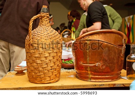 Woven basket and brass bowl on table. Shot in Stellenbosch, Western Cape, South Africa.