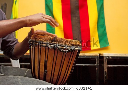Drummer\'s hands playing in indoor party - shot against South African flag. Shot in Stellenbosch, Western Cape, South Africa.