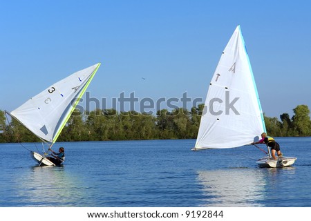 Two racing yachts on river. Shot in July, Dnieper river, Ukraine.