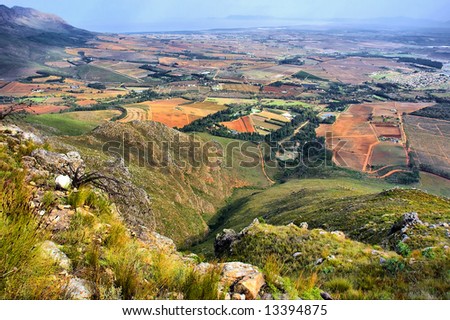 View from peak at misty mountains and sea. Shot from Stellenbosch Mountain, Western Cape, South Africa.