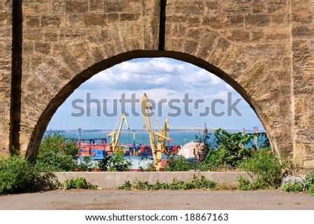 View at sea port through stone arch. Shot in Odessa, Ukraine.