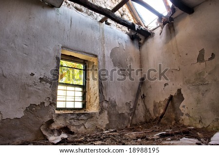 Inside abandoned house - wall with broken window. Shot in West Coast Nature Reserve, near Langebaan, Western Cape; South Africa.