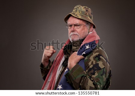Vietnam Veteran with American flag around his neck