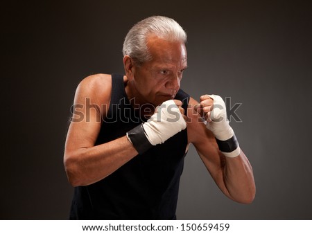 Senior man in a fighting stance