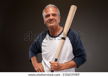 Senior man with baseball bat