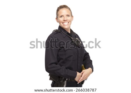 Portrait of female police officer posing with hands clasped
