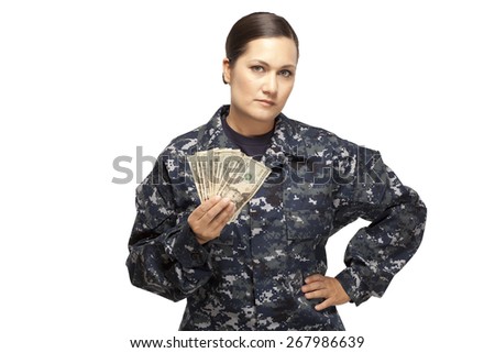 VETERAN SOLDIER | MONEY FOR COLLEGE | PAYDAY LOAN | MILITARY FUNDING| Portrait of serious female navy officer with money against white background