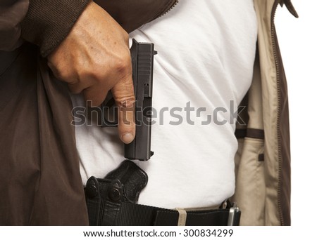 PERSONAL DEFENSE | Concealed Carry gun in holster on belt.  Mature adult with firearm or pistol.