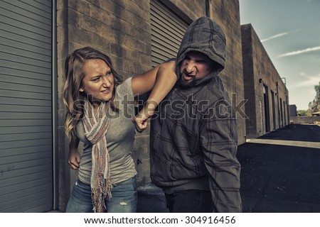 GIRL SELF DEFENSE | A young woman defends herself against a male attacker in an alley by elbowing him in the jaw. Refuse to be a victim.
