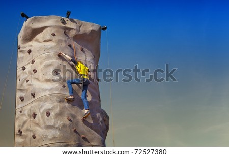 Girl Climbing Rock Wall