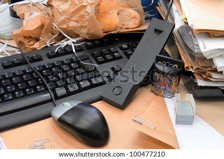 Unsolved documents, unanswered call, mess, files and dust on keyboard and desk.