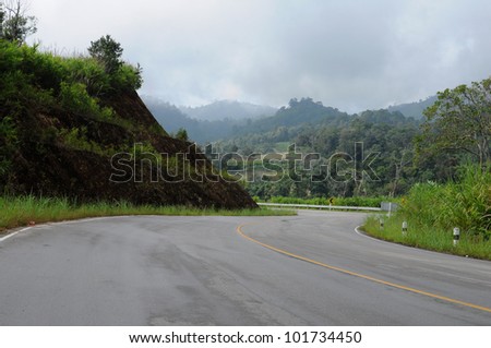 Curve road over blue sky in thailand.
