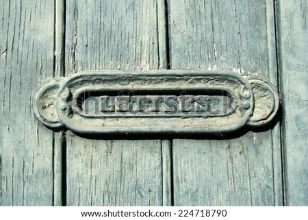 Letter box in a wooden door