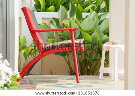 Relax by sit on the red chair in front of you home.