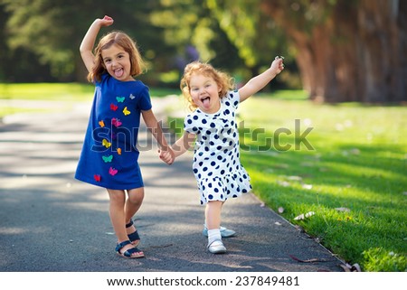 Two Little Girls Having Fun in the Park